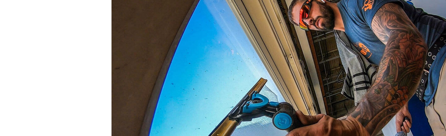 SteveO the Window Cleaner using the Moerman Excelerator 2.0 Squeegee Handle and Brass Channel to Clean Window