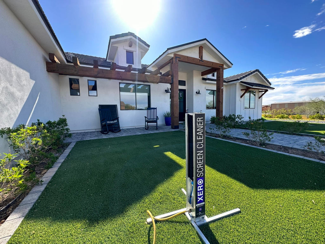 XERO Screen Cleaner on front lawn of house on bright sunny day.