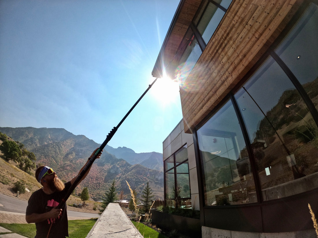 Window Cleaning a House in the Harsh Sun