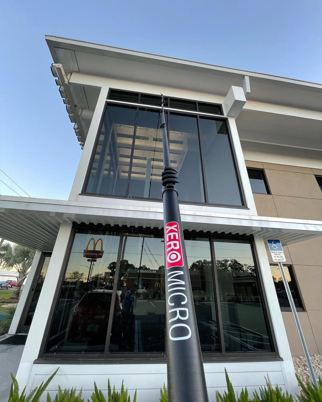 Tinted Windows Being Cleaned With Xero Micro Pole