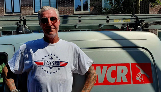 Frank Wearing WCR merchandise t-shirt and car decal. 