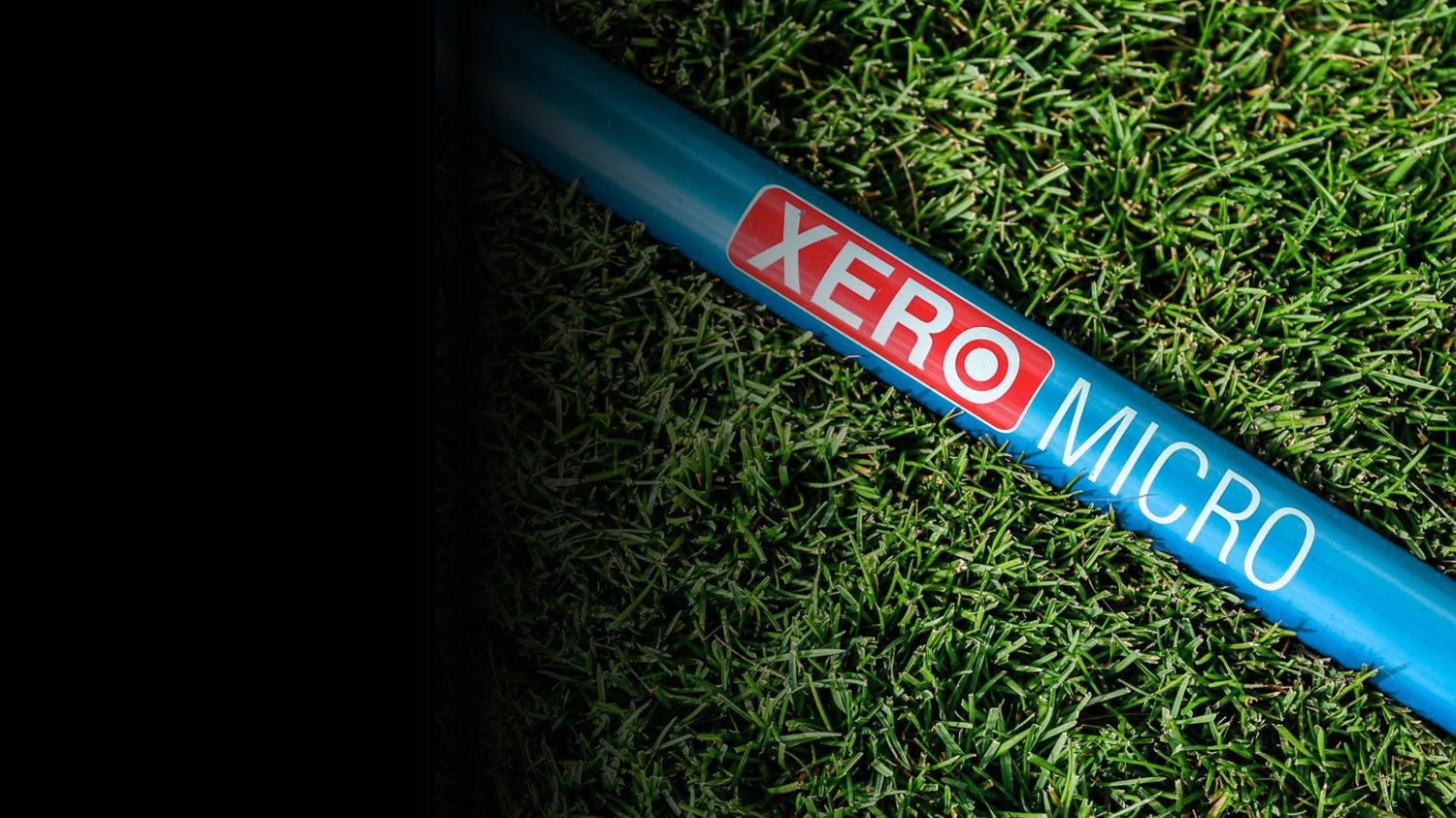 Xero Micro Water Fed Pole Laying in lush green grass