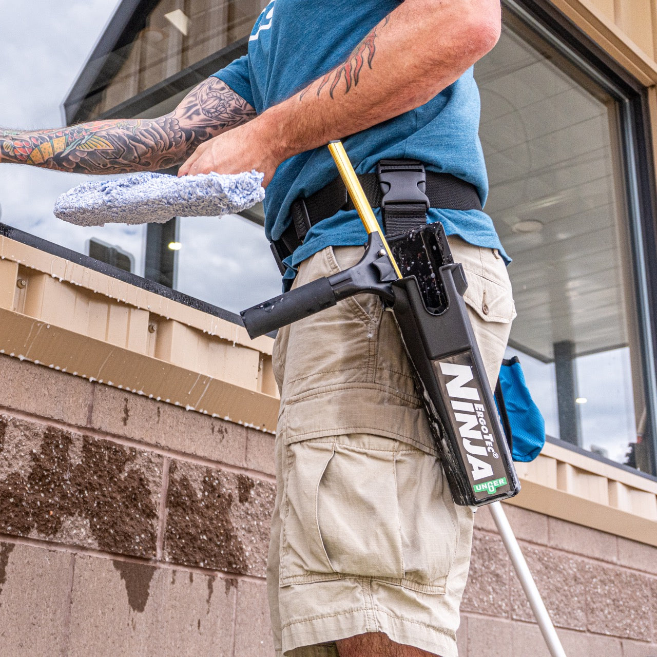 Ettore Brass Ledge-Eze Squeegee Handle in Use