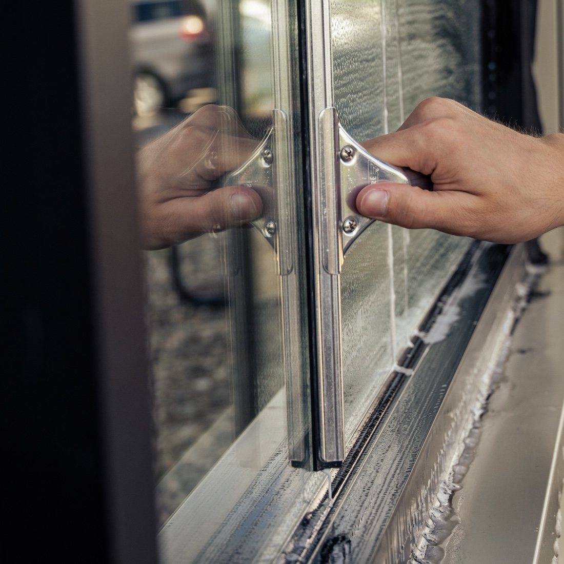 Complete Ettore Stainless Steel Squeegee on Glass