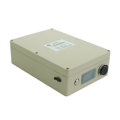 Angled view of beige battery control unit with screen buttons and labeled top panel.