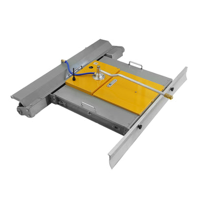 Angled front view of robot showing tracks and yellow brush area.
