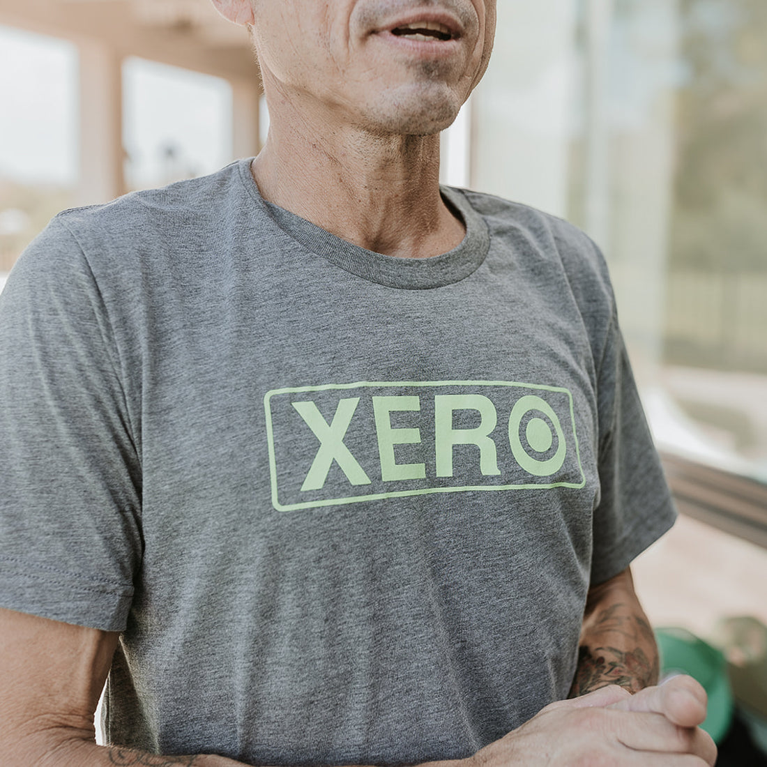 XERO Graphite Tee on a Window Cleaner