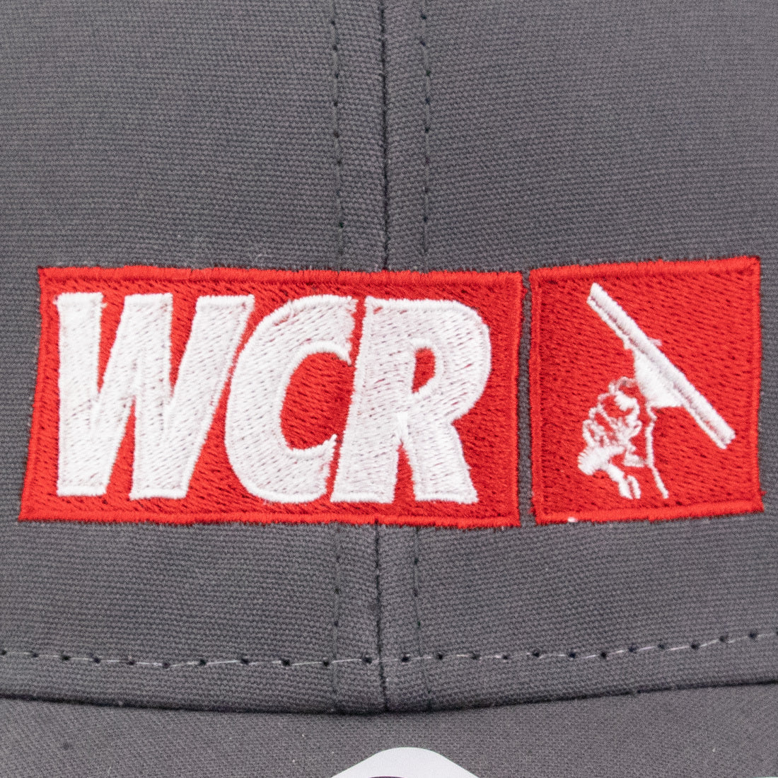 WCR Trucker Cap - Dark Gray Detailed Logo Close-Up View